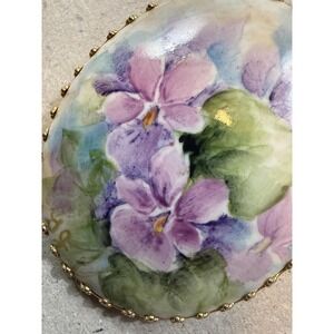 MCM porcelain hand-painted purple flower green leaves brooch gold-tone setting